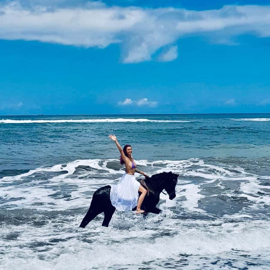 Bali: Horseback Tour Through Saba Beach and Local Temples. - Riding the black sand at Saba Beach