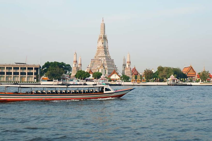 Bangkok: Canal Tour, River Local Life & Wat Arun Guide Visit - Boarding the teak boat