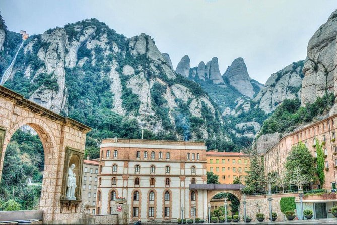 Barcelona to Montserrat Monastery: Tour, Transfers & Basilica - Funiculars, museum visits, and extra costs