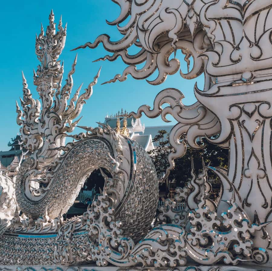 From Chiang Mai: Chiang Rai Temples and Golden Triangle Tour - Wat Rong Suea Ten, the Blue Temple, changes the mood