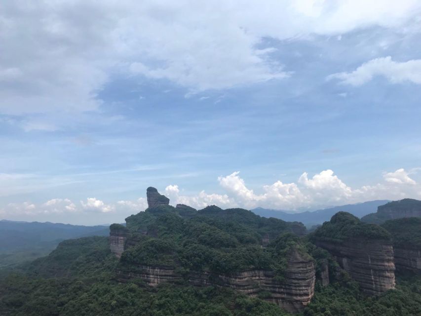 From Guangzhou: Mount Danxia and Nanhua Temple Full-Day - Yang Yuan Stone and the mountain’s cheeky landmark