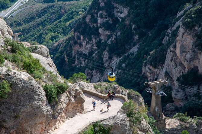 Montserrat Tour with Cogwheel Train, Monastery & Black Madonna - Four local liquors and the audiovisual exhibition