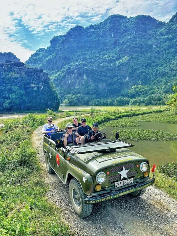 Ninh Binh Jeep Adventure: Temples, Lotus, Fishing & Cooking - Thai Vi Temple among rice fields and karst peaks