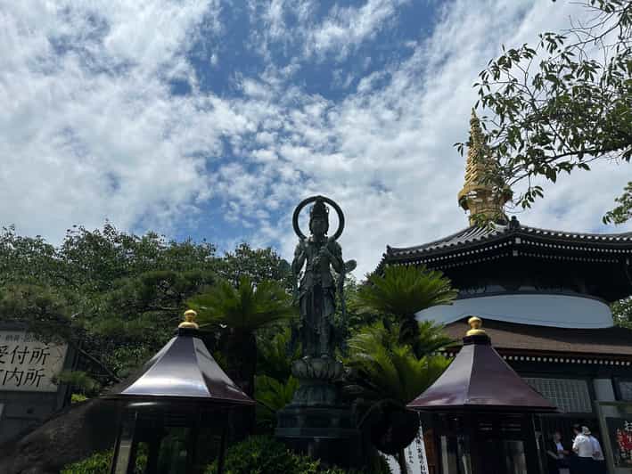 Osaka: Japan’s Oldest Temple & Bone Buddha Walking Tour - Meeting at Shitennoji’s stone torii