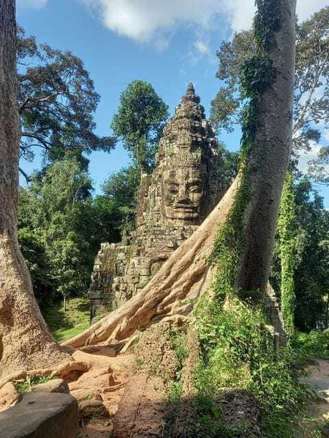 Shared day tour with Spanish-speaking guide at Angkor Temple. - Royal power at the two terraces