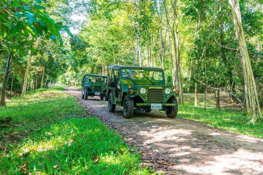 Siem Reap: Angkor Sunrise Jeep Tour / SUV Car Available - Bayon and Angkor Thom: faces, gates, and royal power