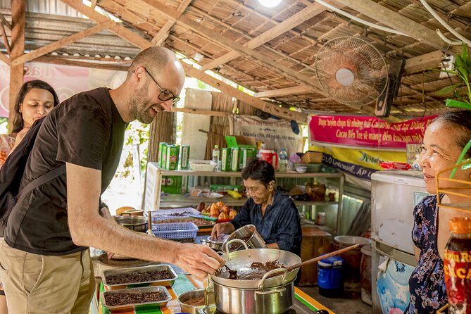 Small-Group Mekong Delta Day Trip: Boat Ride, Cottages & Pagoda - Garden paths, village cycling and the cottage setting