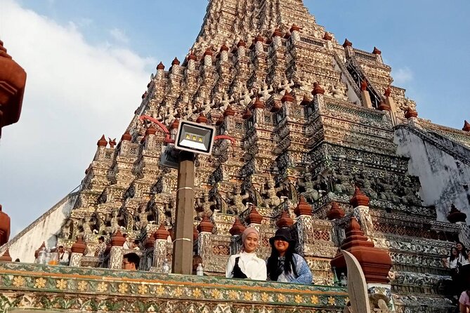 Visit Wat Pho and Wat Arun with Local Expert - Wat Pho: the reclining Buddha and a large temple compound